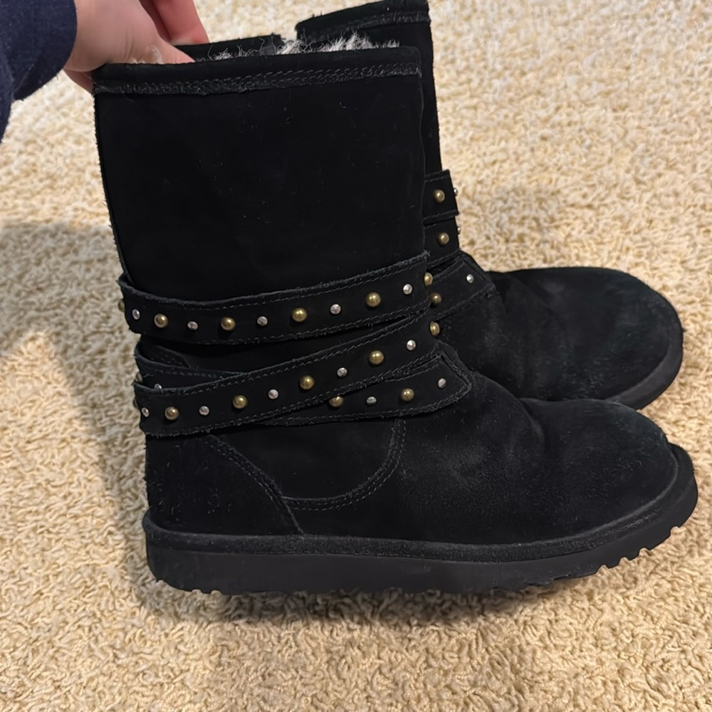 Black Ugg boots with silver and gold detailing. Very cute. Kids size 5.